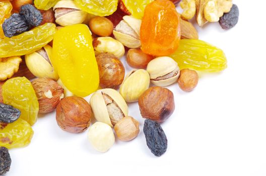 Groups of various nuts of dried fruits on white background