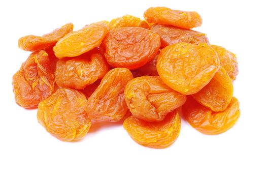 heap of dried apricots over white