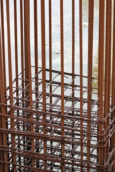 Rusty metal reinforcement bars mesh at construction site.