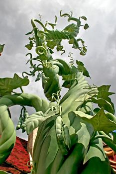 A beanstalk growing up into the sky
