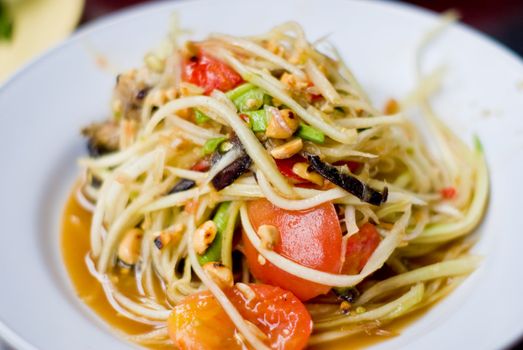 Green papaya salad inside dish, Thai style