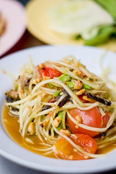 Green papaya salad inside dish, Thai style