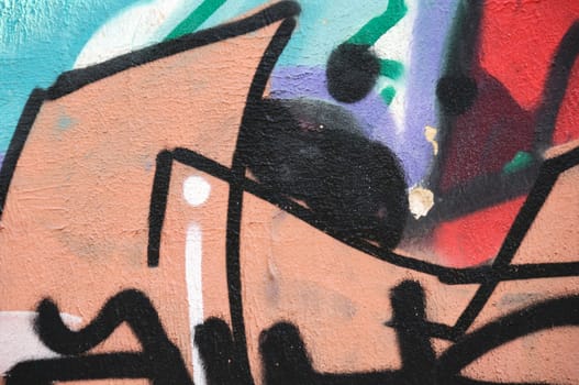 Abstract graffiti on weathered wall. Urban street art.