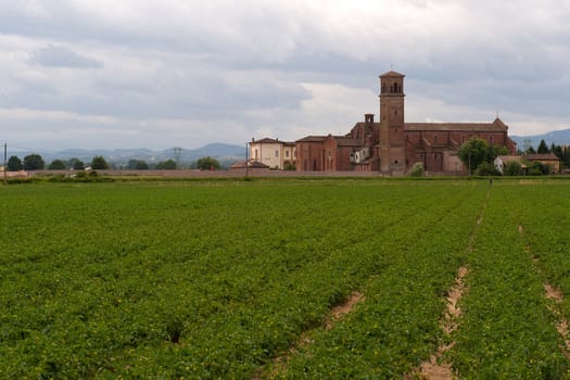 a church at the end of a meadow