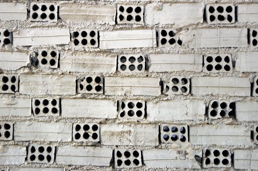 Weathered white brick wall texture background.