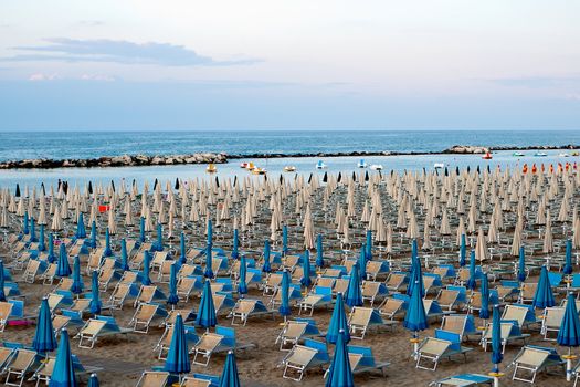 a panoramic view of the beach with chairs and umbrellas