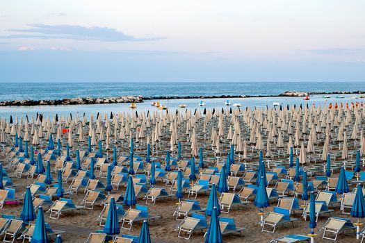 a panoramic view of the beach with chairs and umbrellas