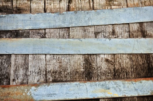 Wooden barrel and rusty metal stripes texture.