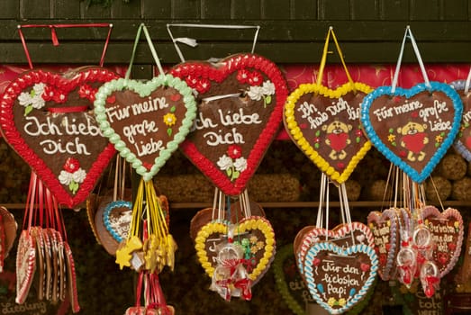 Colorful traditional gingerbread hearts at Christmas market in Germany