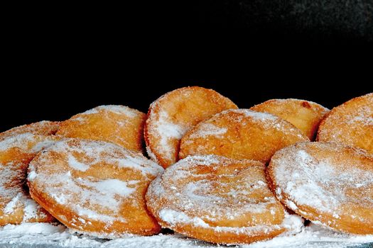 a lot of dutch food, named 'appelbeignets' with suger