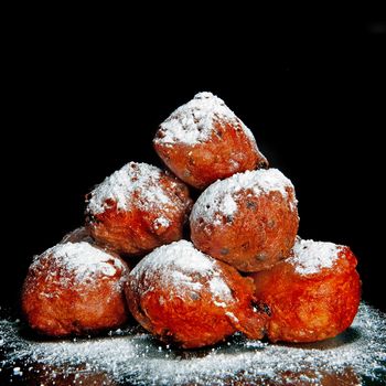 a lot of dutch food, named 'oliebollen' with suger