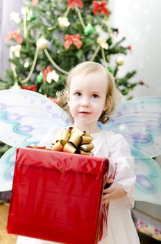 little girl holding christmas gift