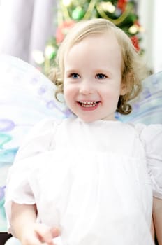 little girl smiling at Christmas