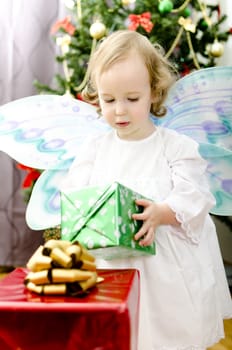 little girl holding christmas gift