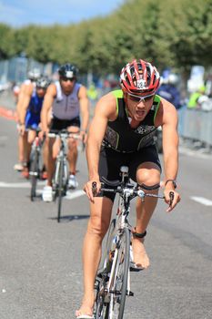 Male cyclist without shoes at the International Triathlon 2011, Geneva, Switzerland