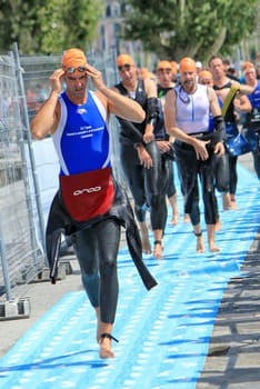 Male runners in the transition area after the swim race at the Geneva International triathlon, on July 24, 2011, Geneva, Switzerland