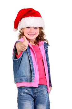 Little girl in denim suit and a hat of Santa Claus on the white background
