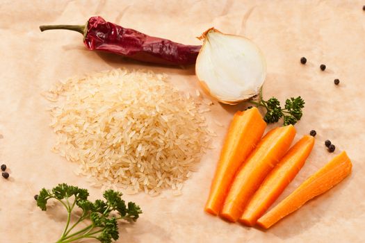 hill of raw rice with vegetables 
and parsley