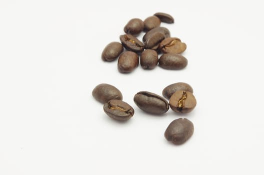 a few of coffee beans, isolated on white.