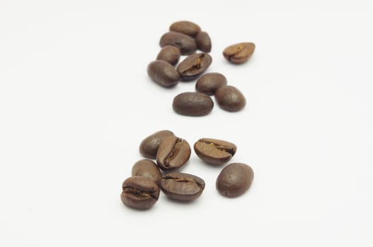 a few of coffee beans, isolated on white.