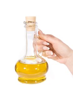 Woman hand with jug of olive oil over white