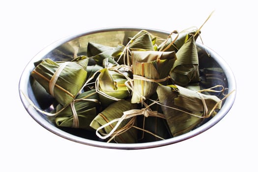 chinese style rice dumplings in a big bowl, isolated on white.