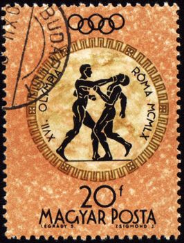HUNGARY - CIRCA 1960: A post stamp printed in Hungary shows boxing, devoted Olympic games in Rome, series, circa 1960