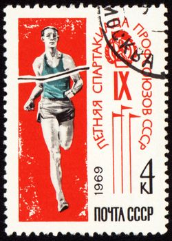 USSR - CIRCA 1969: A stamp printed in USSR shows running sportsman at finishing tape, devoted Olympics of the USSR, circa 1969