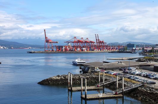 Industrial cranes in Vancouver BC, import export commerce terminal & passengers terminal Canada.