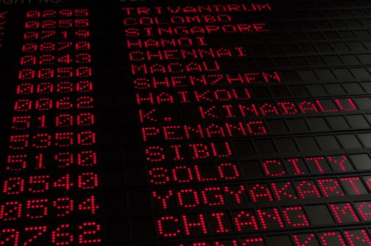 flight schedule in airport, destinations of asia cities are shown.
