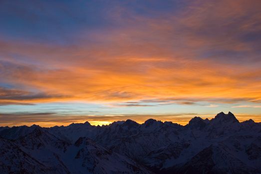 Nature background. Beautiful Sunrise in winter mountains