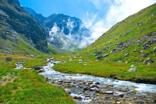 Outdoors. Beautiful river on the green field