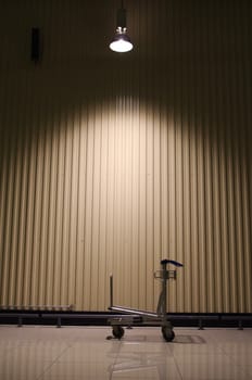 A trolley is left behind in a warehouse