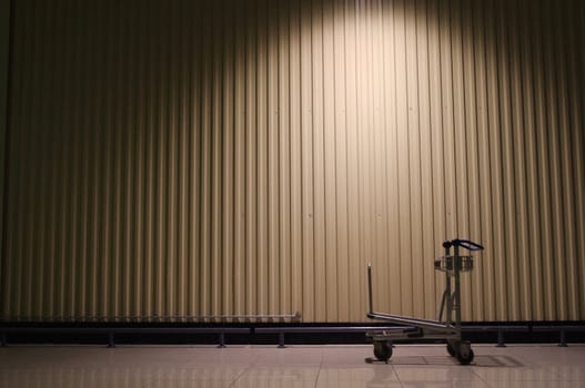 A trolley is left behind in a warehouse