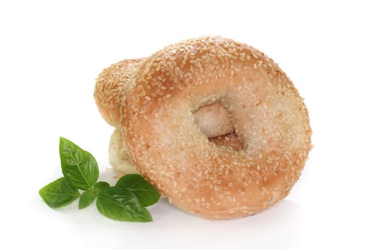 three bagel and basil on a white background
