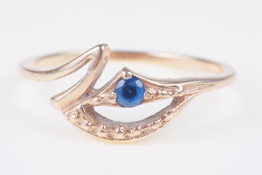  Engagement ring with blue precious stone closeup