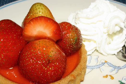 Strawberry tart with whipped cream