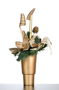 Christmas candle decorations on a golden vase.