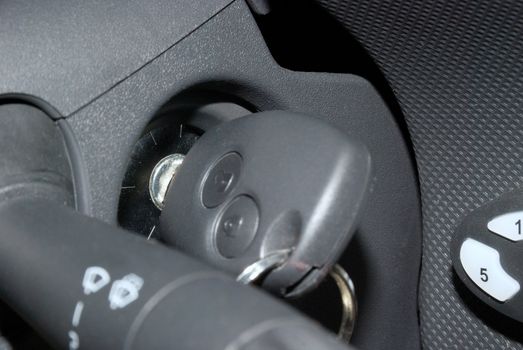Car key in ignition about to start close up
