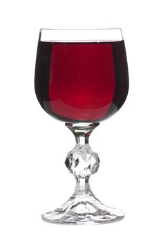 A glass full of ruby wine isolated over white background