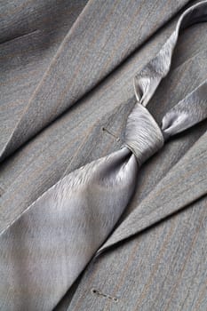 A modern tie and a gray costume