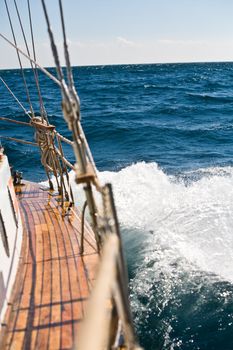 summer series: modern wooden yacht in the sea. Deck view