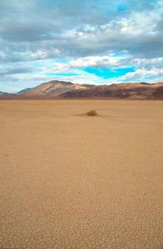 Racetrack Playa is a seasonally dry lake (a playa) located in the northern part of the Panamint Mountains in Death Valley National Park, California, U.S.A.. It is famous for 'sailing stones', rocks that mysteriously move across its surface.