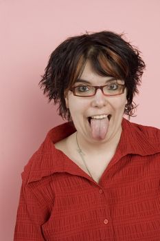 young beaitful woman sticking out tongue