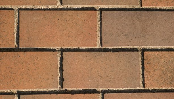Optical illusion, simple brick pattern, clay rectangular tiles left to right. street in Nagoya, Japan.