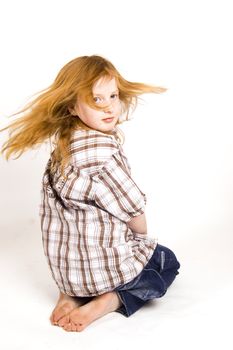 little girl swinging her hair