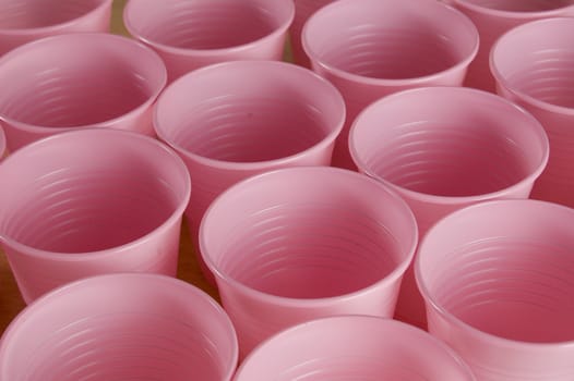a lot of pink plastic cups