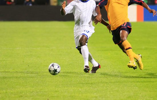 Detail of a soccer game with two players in action