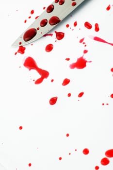 Knife blade with blood drops on white background