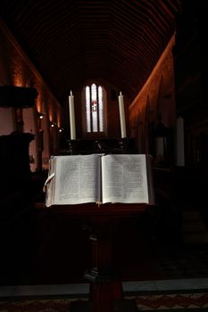 a bible on a stand in an old church